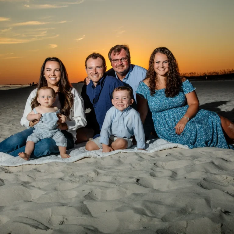 A family beach portrait session at sunset shot by Robert Phillips in the Fort Morgan, Alabama area.