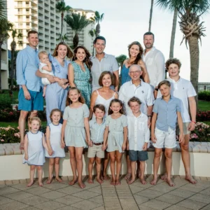 A large family having their photos taken at the beach club right by the beach in Fort Morgan, Alabama.