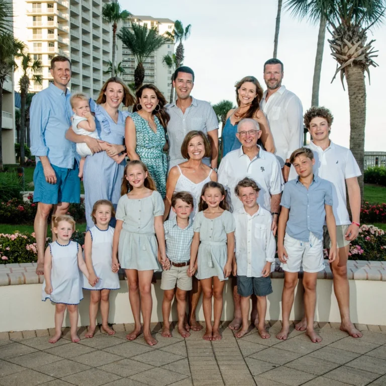 A large family having their photos taken at the beach club right by the beach in Fort Morgan, Alabama.