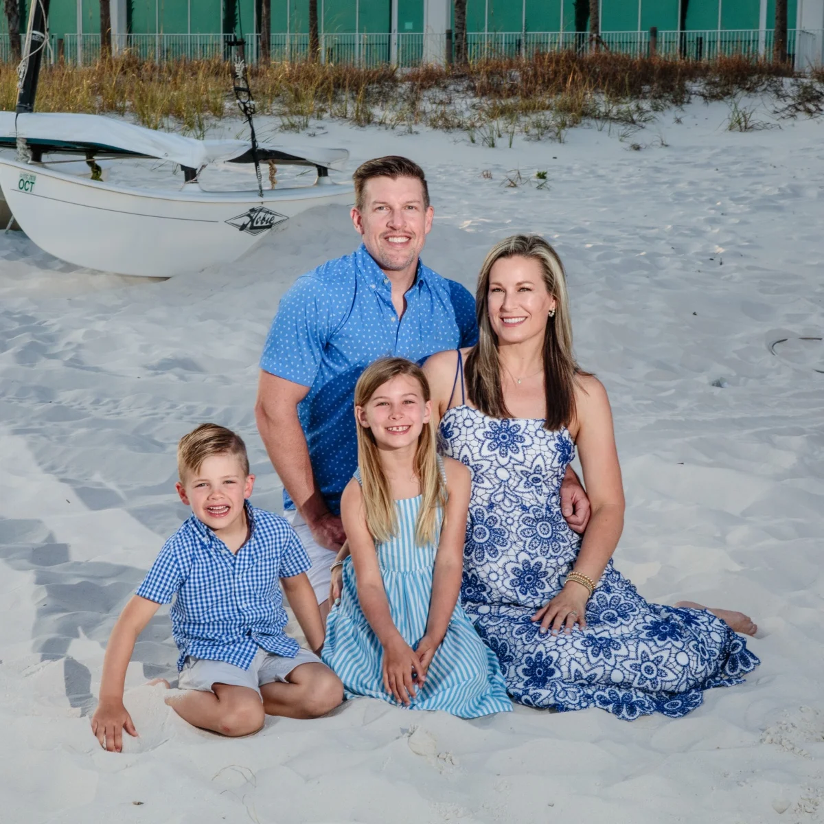 A family of four having their photos taken during a photo session in Fort Morgan, Alabama.