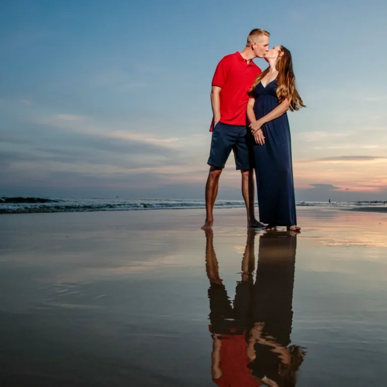 Photo on the beach with a nice reflection in the water of a couple in Fort Morgan, Alabama.
