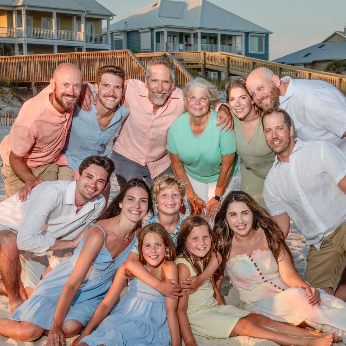 Large family group photo all grouped together on the beach in Fort Morgan, Alabama.