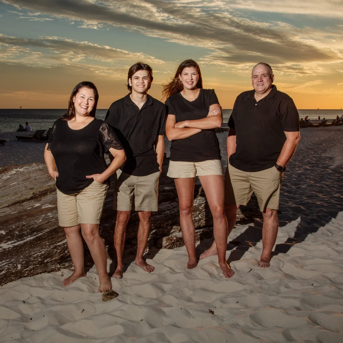 Family of four sunset photo in Fort Morgan, Alabama.