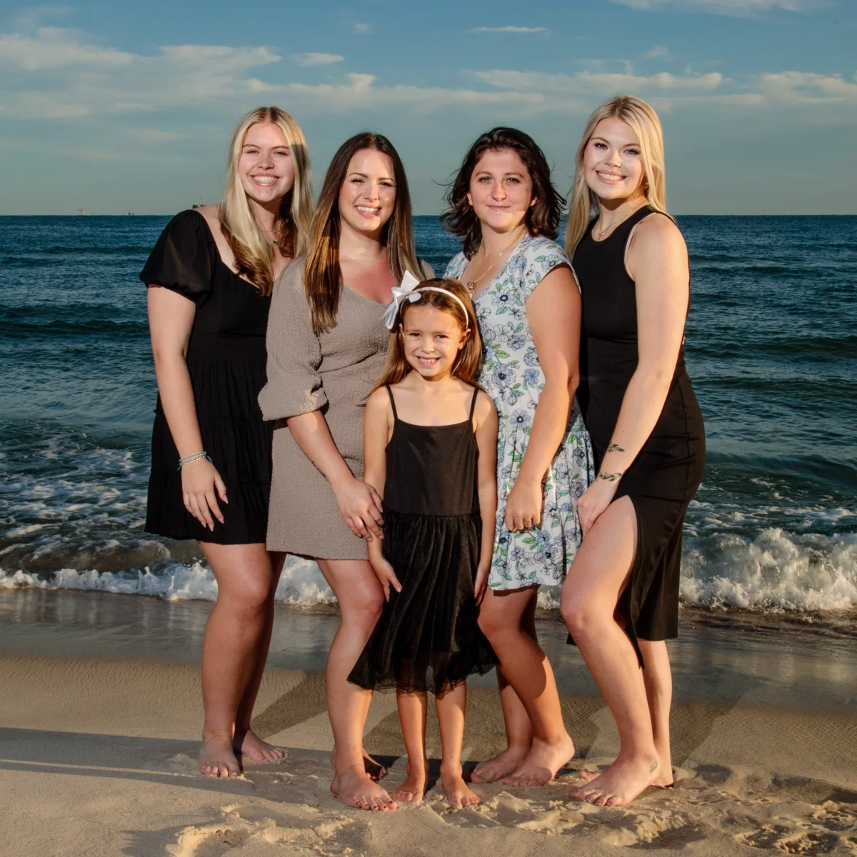 Photo of five girls standing down by the water in Fort Morgan, Alabama.