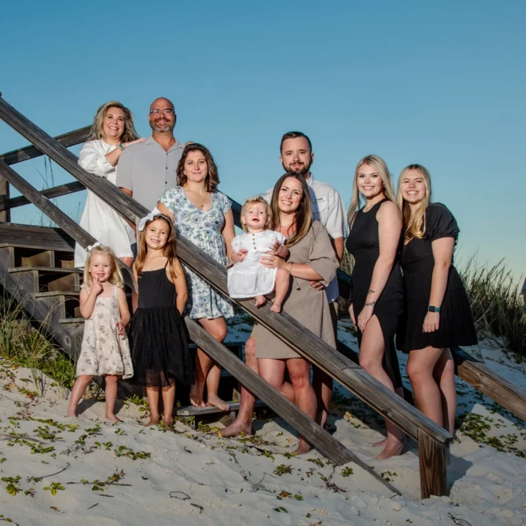 Family group photo in Fort Morgan, Alabama. Standing by the steps leading to the beach.