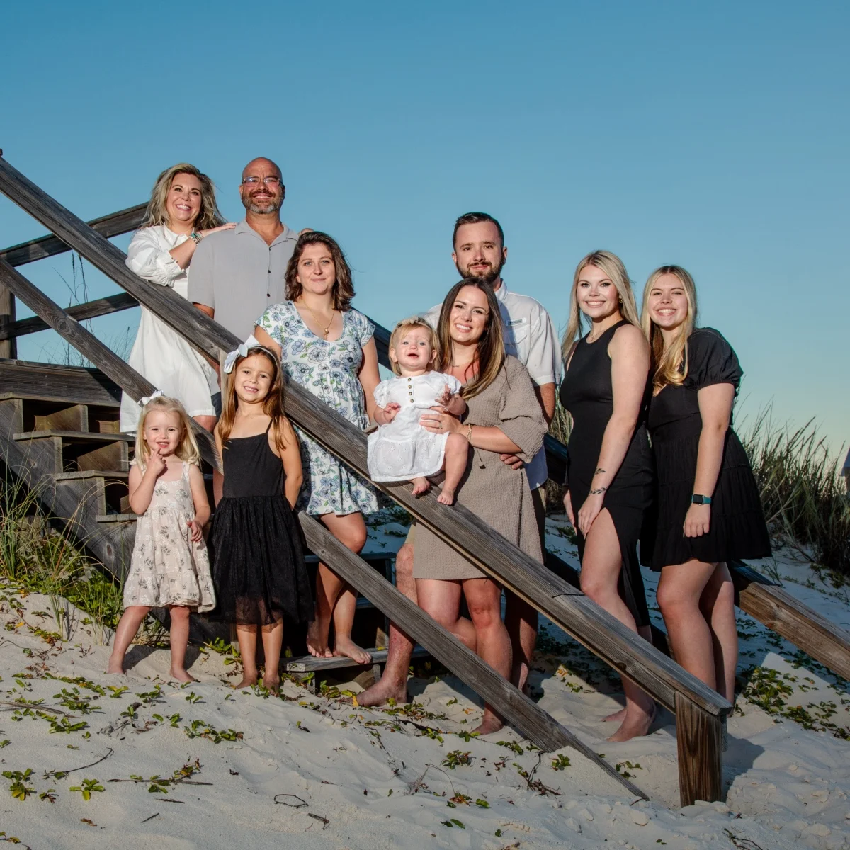 Family group photo in Fort Morgan, Alabama. Standing by the steps leading to the beach.