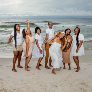 Family having fun on the beach for photos in Fort Morgan Alabama