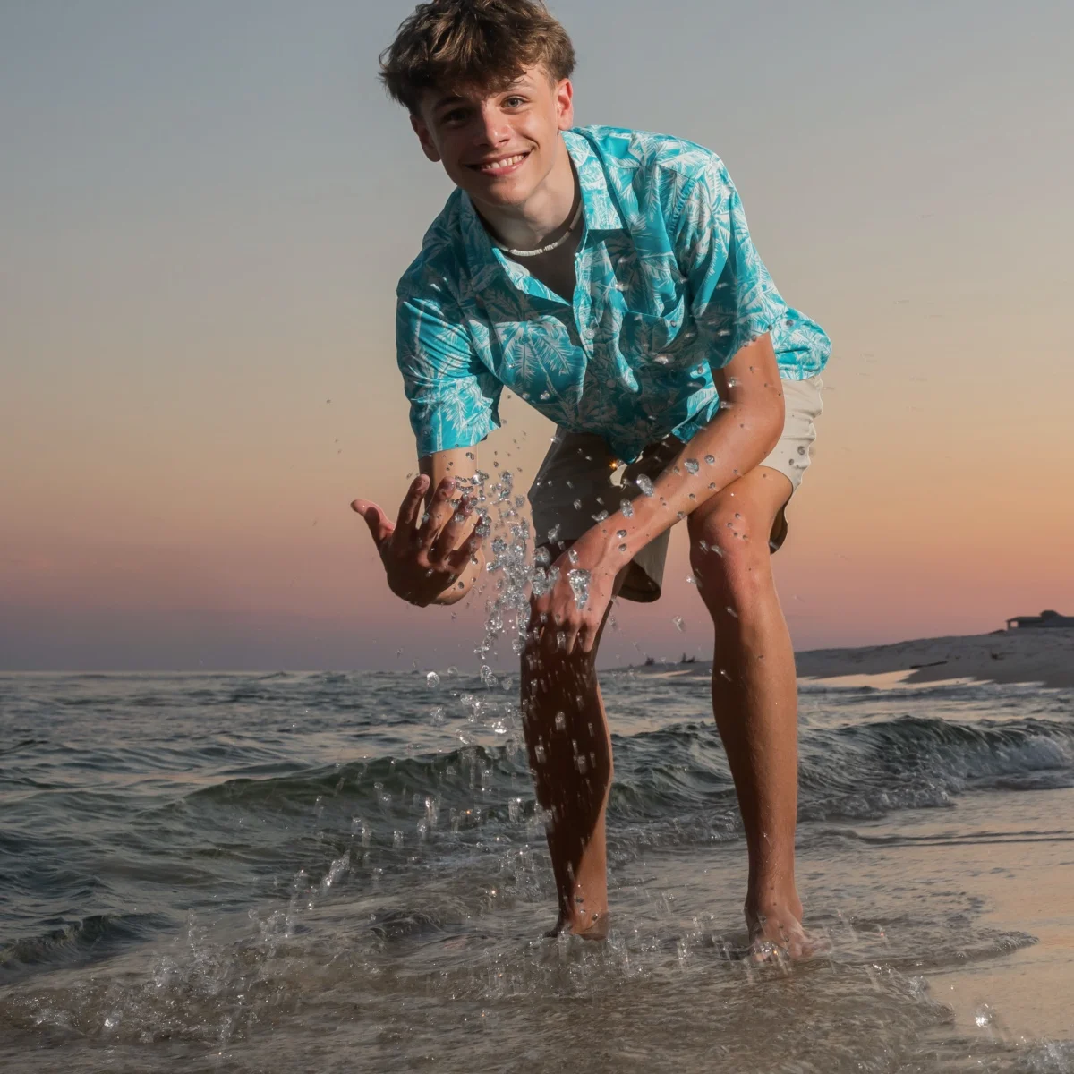 Boy playing in the water photo in Fort Morgan Alabama.
